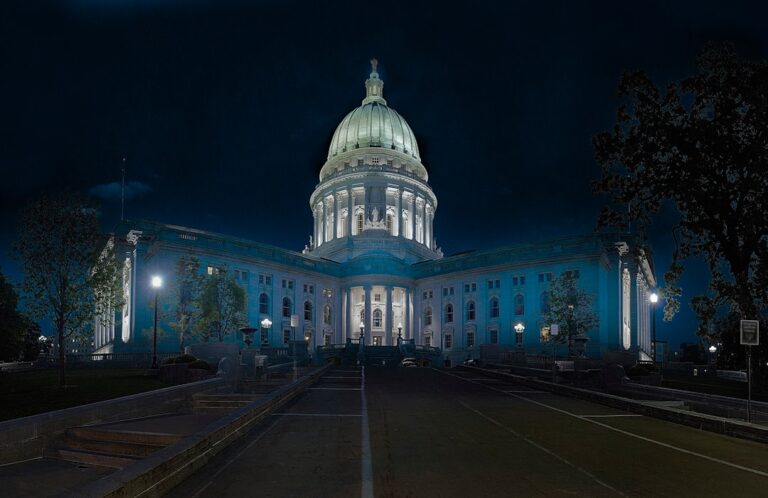 Federal Reserve building illuminated at night, symbolizing stable economic conditions