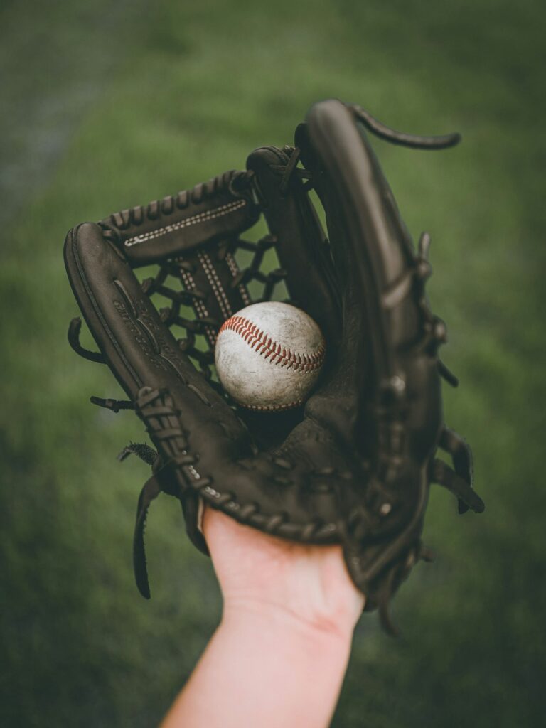 A baseball mitt holding a ball, symbolizing gameplay precision and control