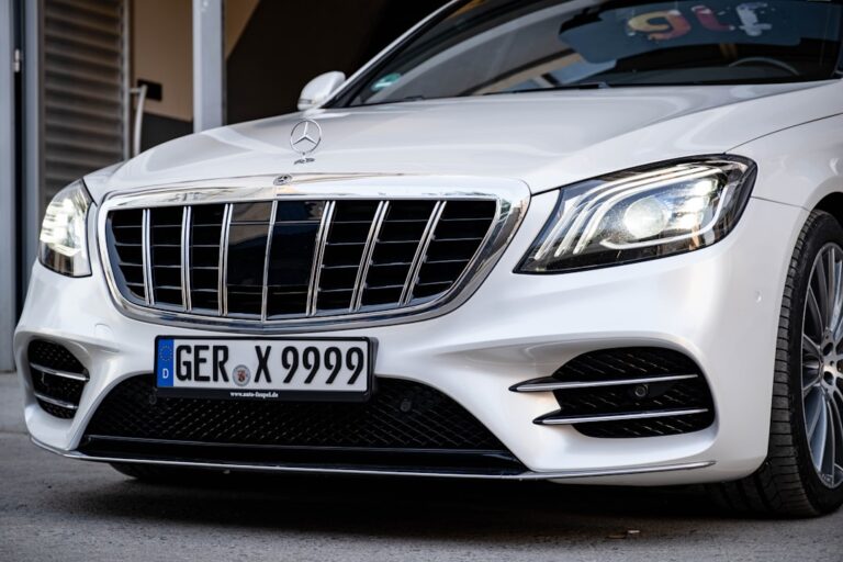 Front view of a luxury Mercedes-Benz car with license plate GER X 9999