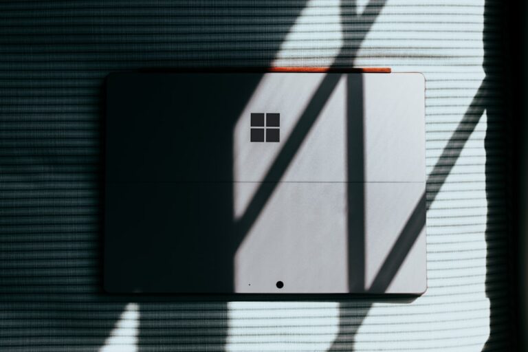 Microsoft tablet casting shadows on a striped surface