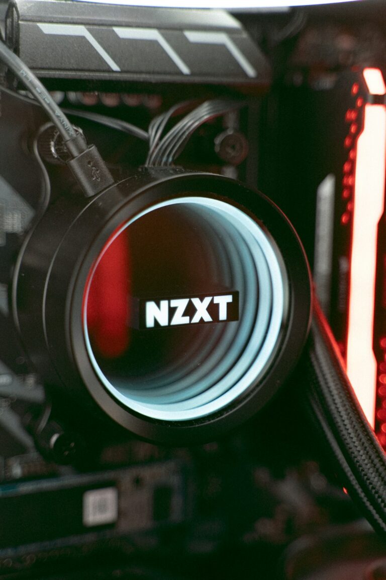 Close-up of NZXT computer hardware component with illuminated LED light