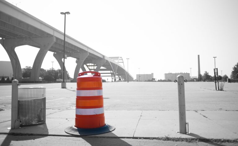 Image of an orange traffic barrel symbolizes obstacles Alphabet Inc. faces with regulatory scrutiny.