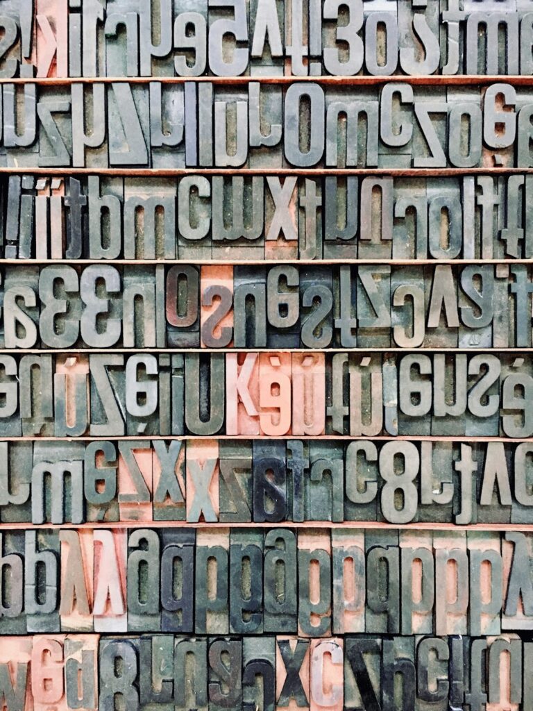 Close-up view of metal typesetting letters highlighting the concept of Alphabet and technology