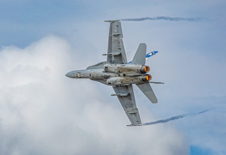 Fighter jet maneuvering in the cloudy sky symbolizing market volatility with Nvidia's upcoming earnings report.