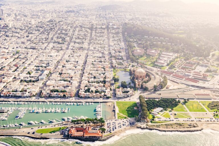 Aerial view of San Francisco's Marina District, showcasing the waterfront, boats, and residential areas.