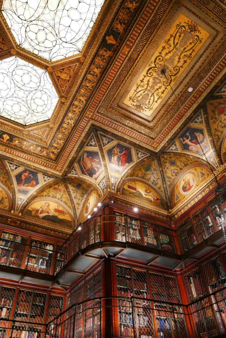 The ornate and historic library of JPMorgan Chase & Co. featuring intricate ceiling designs and bookcases.