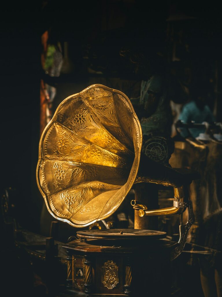 Antique golden gramophone with intricate designs, symbolizing enduring value of gold